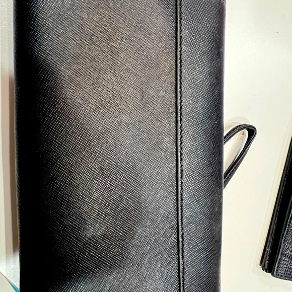 Tory Burch black large wallet with many compartments.